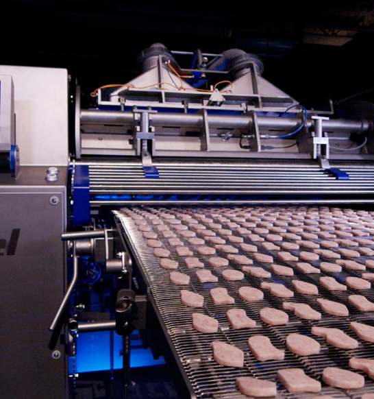 Create better quality convenience products with the Marel RevoPortioner 1000 low-pressure food forming machine